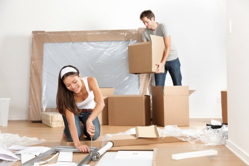 Professional movers loading household items for a Brondesbury relocation