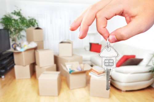 Careful unloading of household items at a Brondesbury home