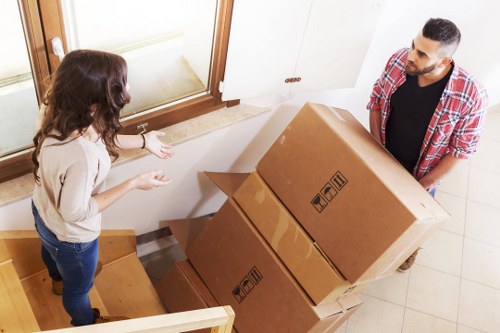 Packed household boxes ready for transport from a Brondesbury flat