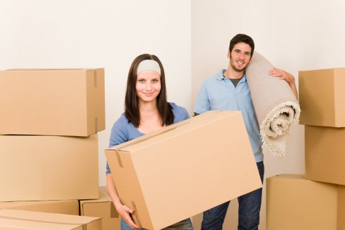 Mover wearing PPE while handling furniture and boxes safely