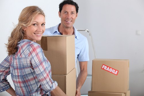 Packed boxes and furniture ready for a local move in Brondesbury