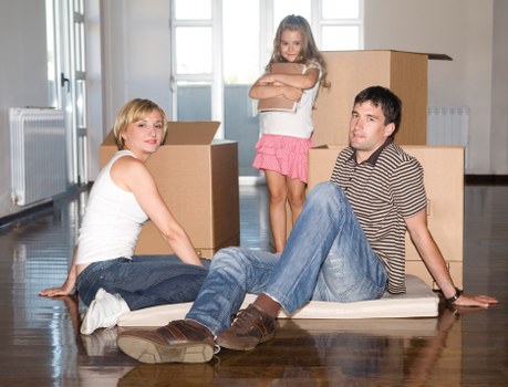 Loading boxes and furniture into a van near Brondesbury